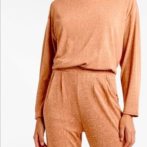 Express- Silky sueded jerseys snake skin top.